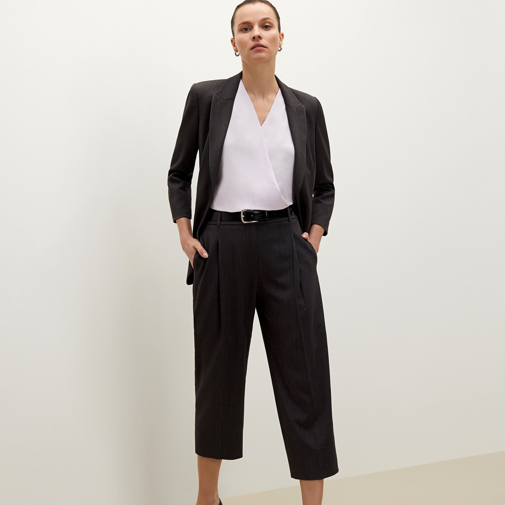 Front image of a woman standing wearing the Isadora pant in charcoal | Lead