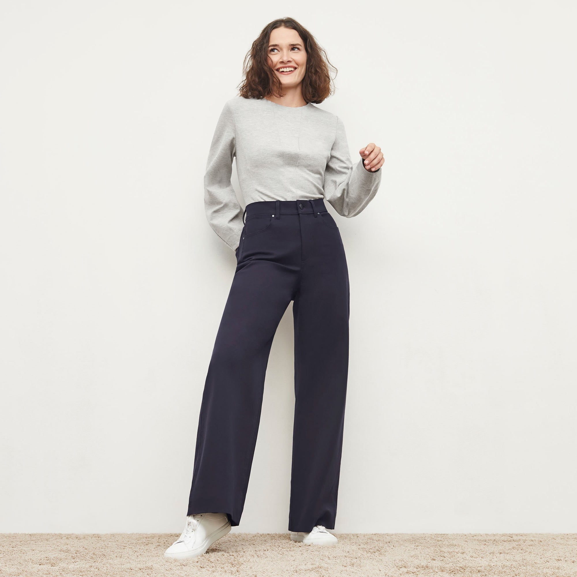 Front image of a woman standing wearing the Milo Jean in ink | Exclude
