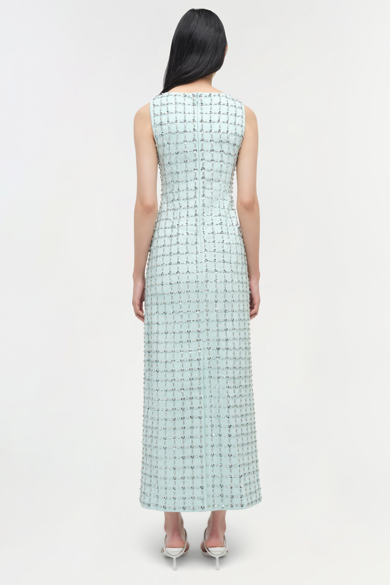 Light blue sleeveless midi dress with allover sequin embellishments, shown from back view on model.
