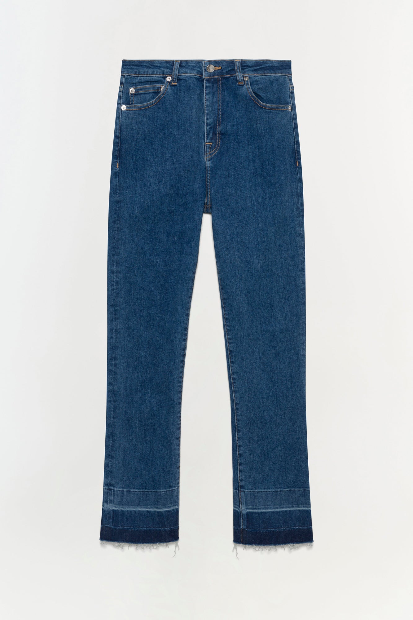 Blue straight-leg jeans with white button hardware and raw-edge cropped hems against white background.