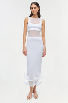 Woman wearing white ribbed sleeveless tank top with sheer mesh panels at chest and waist.