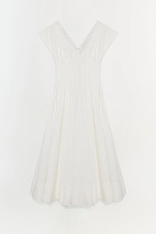 White cotton midi dress with cap sleeves, V-neckline, and pleated A-line skirt.