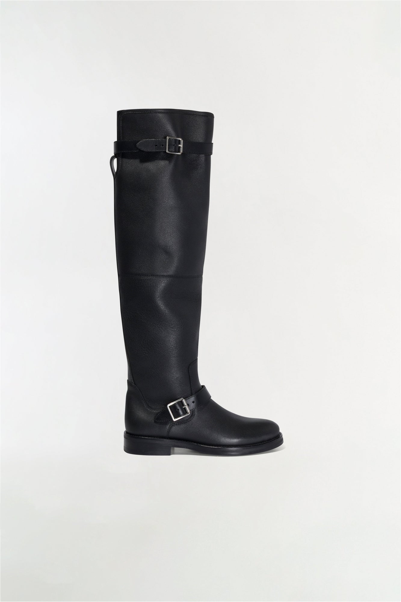 Black leather over-the-knee boot with buckle straps at calf and ankle, flat sole.