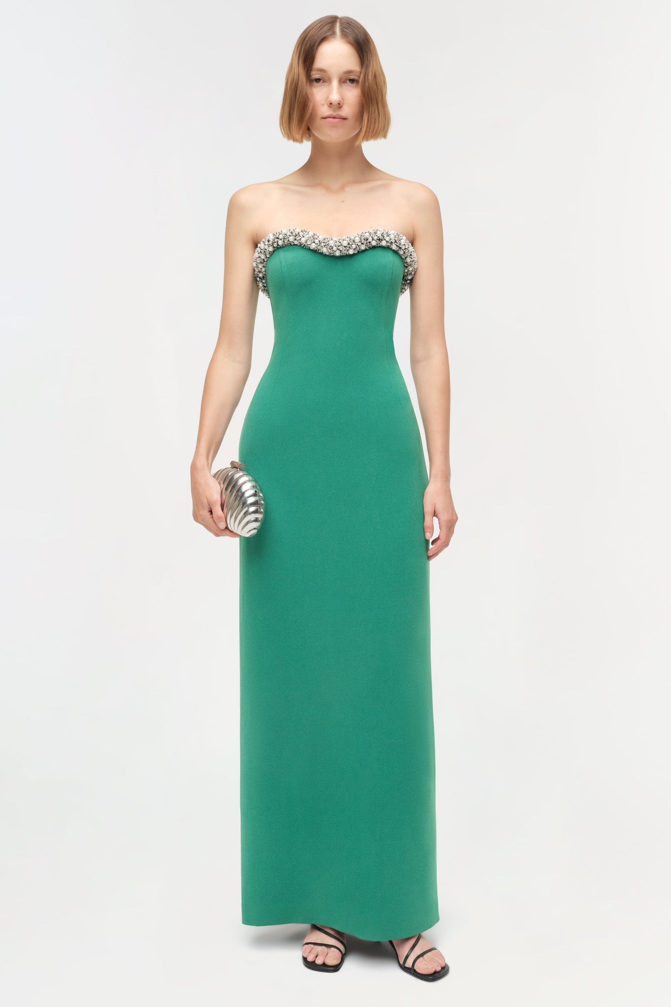 Green strapless floor-length gown with crystal embellishments around the neckline and sweetheart bustier top.