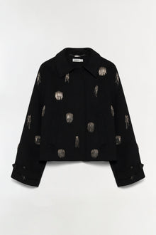 Black cropped jacket with silver beaded embellishments scattered across the front and sleeves.
