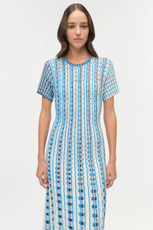 Blue and white striped knit midi dress with short sleeves and textured eyelet pattern throughout.
