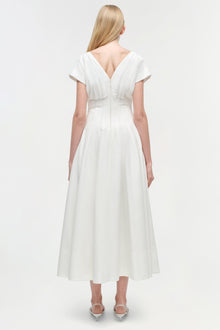 White cotton midi dress with short sleeves, V-neckline, and gathered waist detail, shown from back view.
