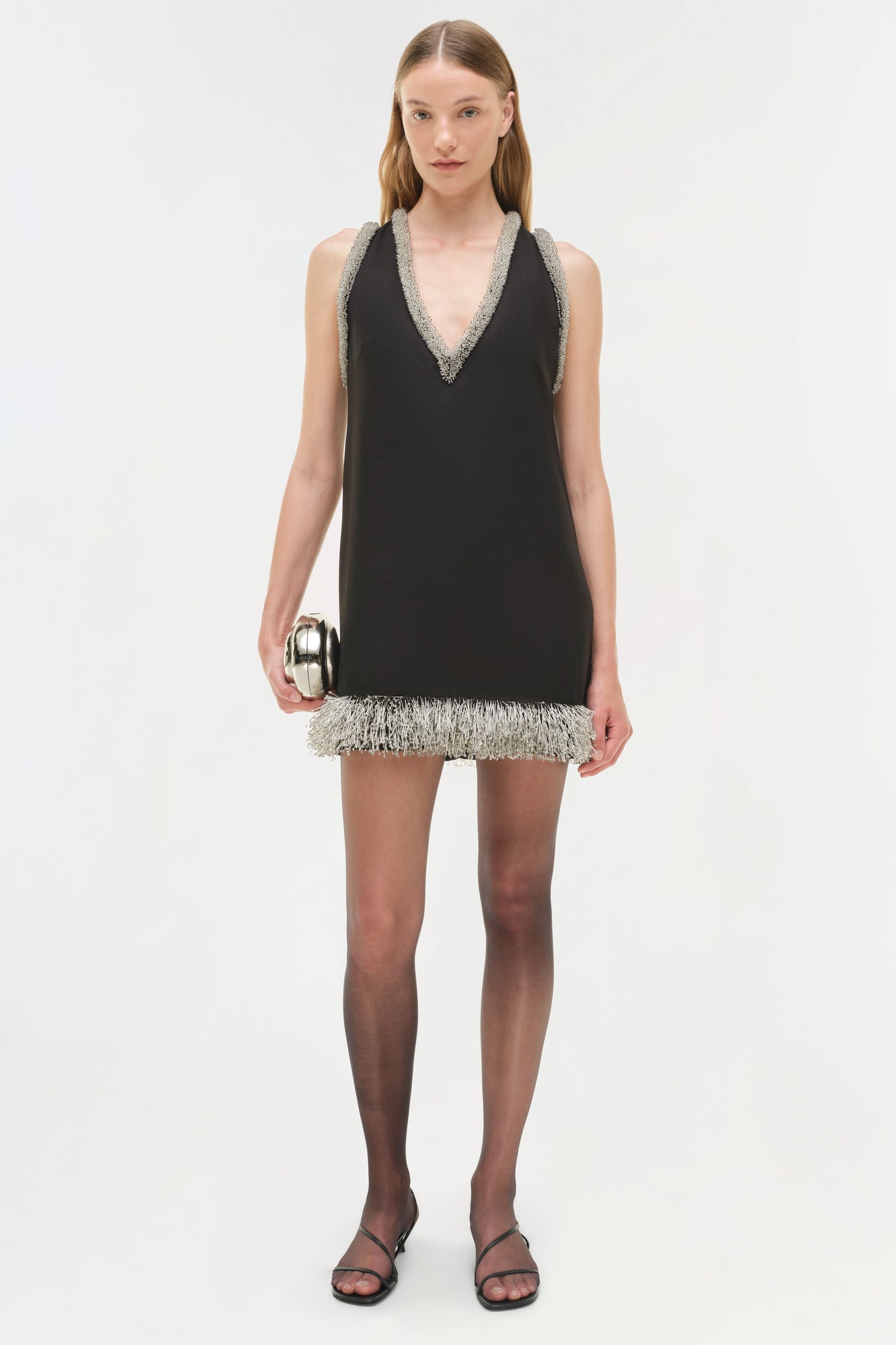 Black sleeveless mini dress with crystal-embellished V-neckline and matching beaded hem trim.