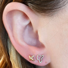 14k recycled gold Full Pave Ripple Stud Earring. Styled on a ear with a stitch stud earring