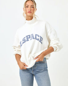 Studio torso view of the Crush Sweatshirt in cream, a cream quarter-zip pullover sweatshirt with 