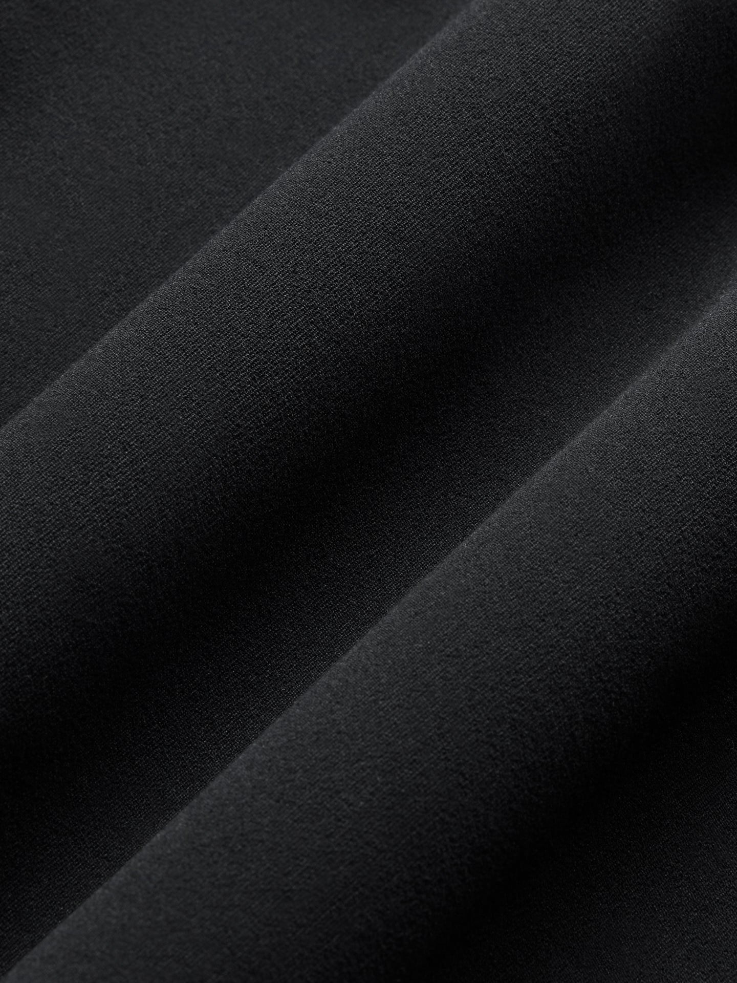 Close-up of Melt fabric in black, soft and smooth texture.