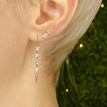 14k gold Diamond Drop Earrings with emerald cut, cushion cut, trillion cut, Pear cut, baguette cut diamonds on an ear