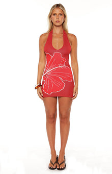 Model wears the Elissa Red Knit Hibiscus Mini Dress a bodycon halter dress perfect for your next vacation or a summer party.