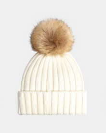 The ANISA - L423500 Optic White by Rudsak is a white ribbed knit beanie with a wide folded brim and a large brown faux fur pom pom—an essential winter accessory for fans of women's knit pom pom hats.