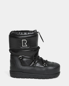 The KIKA - L224506 Black by Rudsak is a women's black high-top winter boot with a chunky rubber sole, quilted upper, lace-up front, drawstring closure, and an 