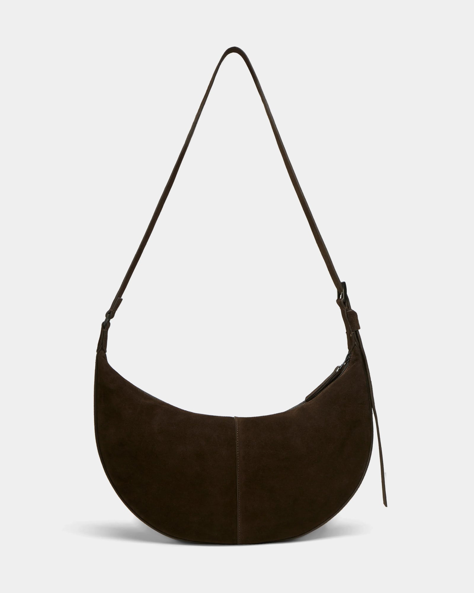 The Rudsak LANISSA S - 8324520 Espresso is a dark brown suede crescent-shaped hobo bag with a long strap and zipper closure, perfect as a minimalist womens crossbody. Displayed against a plain white background.