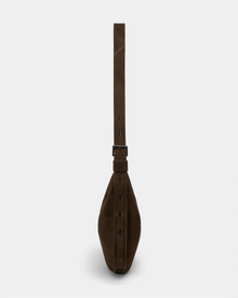 Side view of the Rudsak LANISSA S - 8324520 Espresso brown suede hobo bag, featuring a wide adjustable strap with buckle, shown against a plain light gray background.