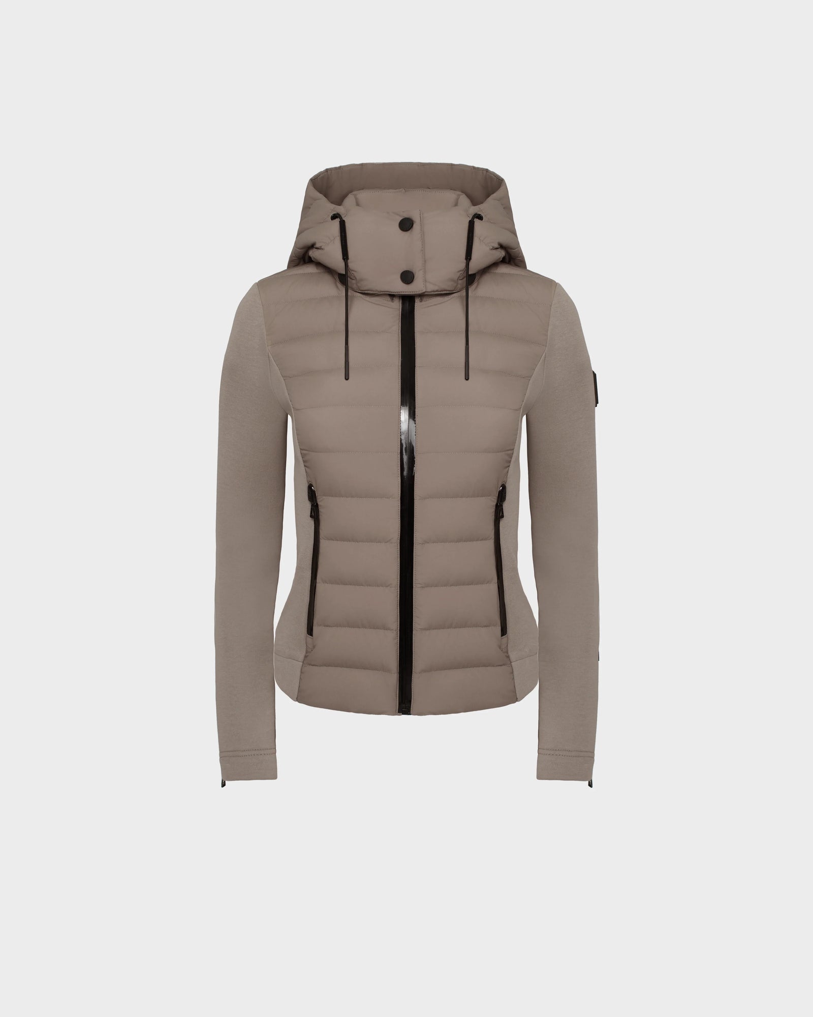 The Rudsak MABS - 8124825 Cement is a taupe women’s jacket featuring quilted panels, long sleeves, black zipper details, and hood drawstrings. This lightweight short jacket is shown on a plain white background.