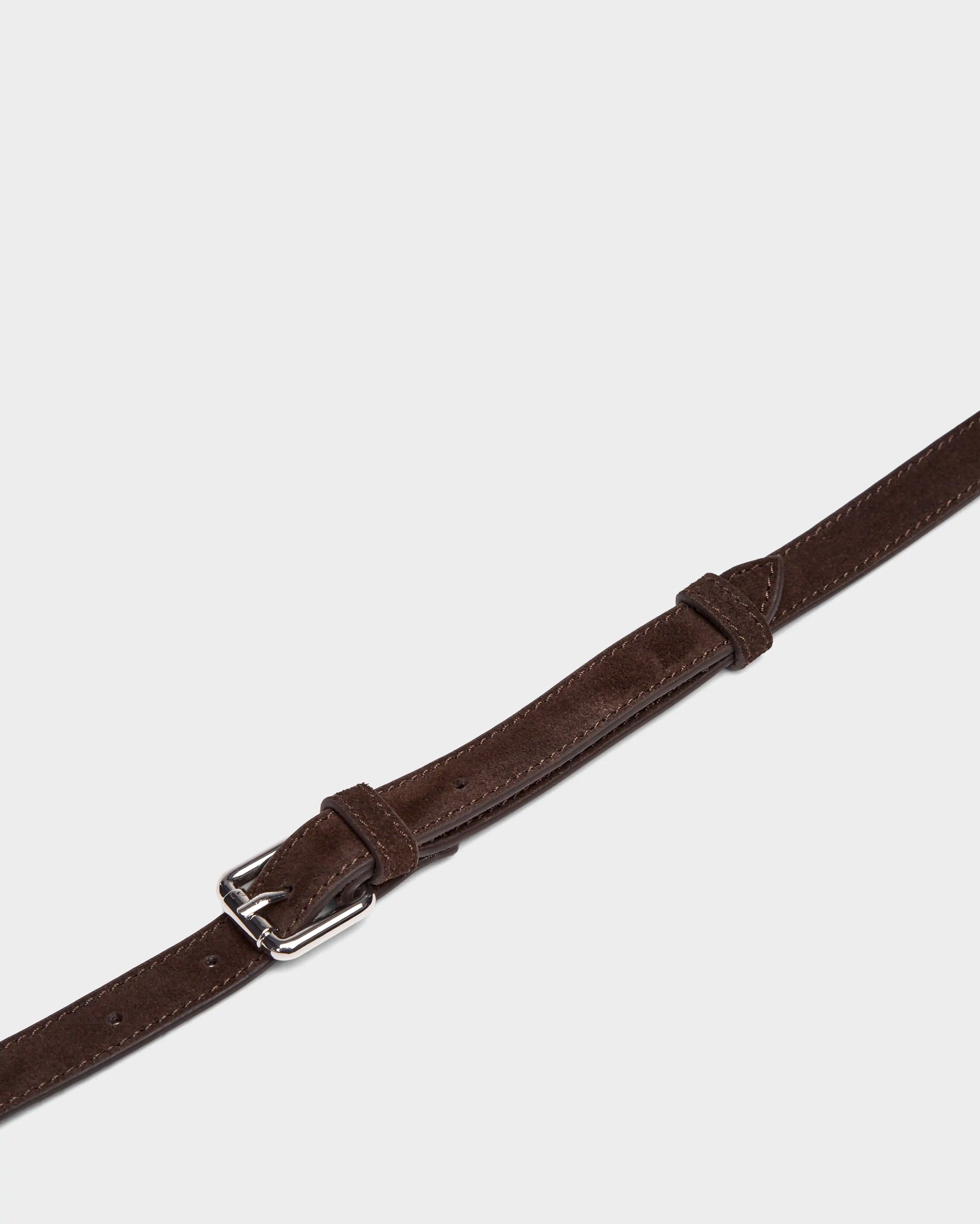A close-up of the Rudsak PREYA - 8324508 Espresso brown leather strap with visible stitching and a silver buckle, set against a plain white background.