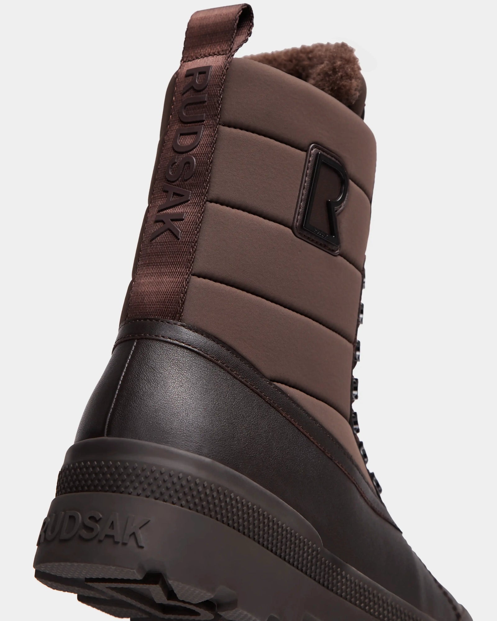 A close-up of the Rudsak REAGAN - 6224501 Espresso men’s winter boots, highlighting their sturdy design and durable materials.
