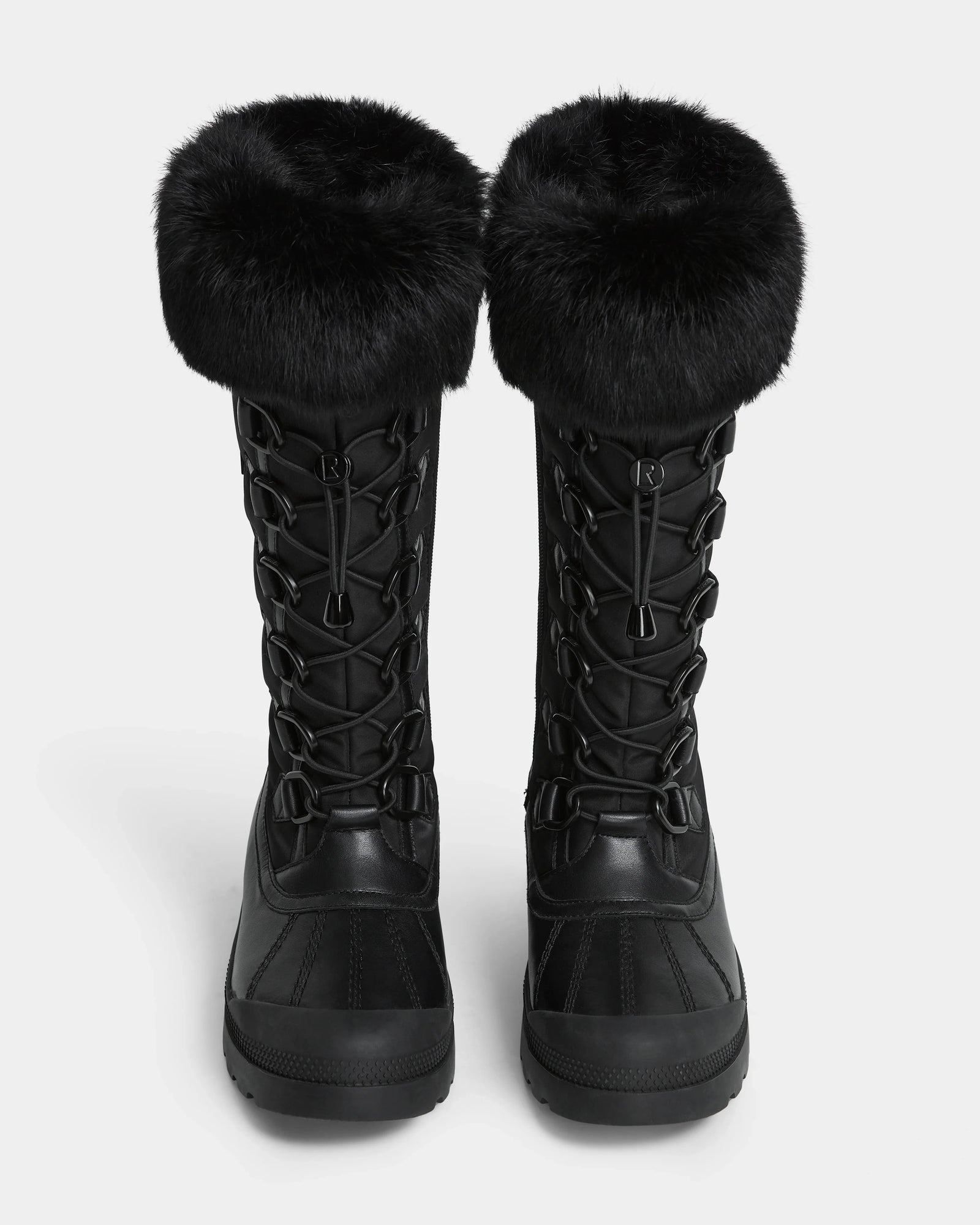 The Rudsak WINDY - L224507 Black women's winter boots feature thick faux fur trim cuffs and lace-up fronts, shown side by side on a white background for cold-weather comfort.