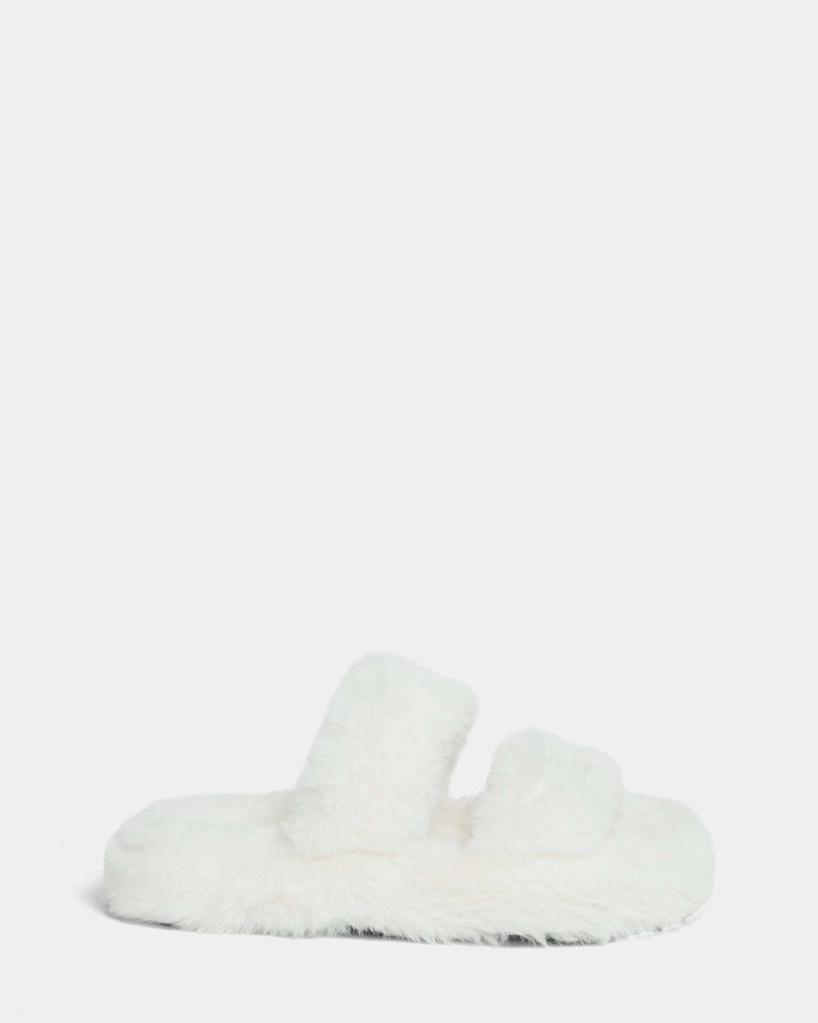 The Rudsak ZETA - 8224508 Iceland is a fluffy white womens faux fur slipper with two thick straps and a cozy design, shown against a plain light gray background.