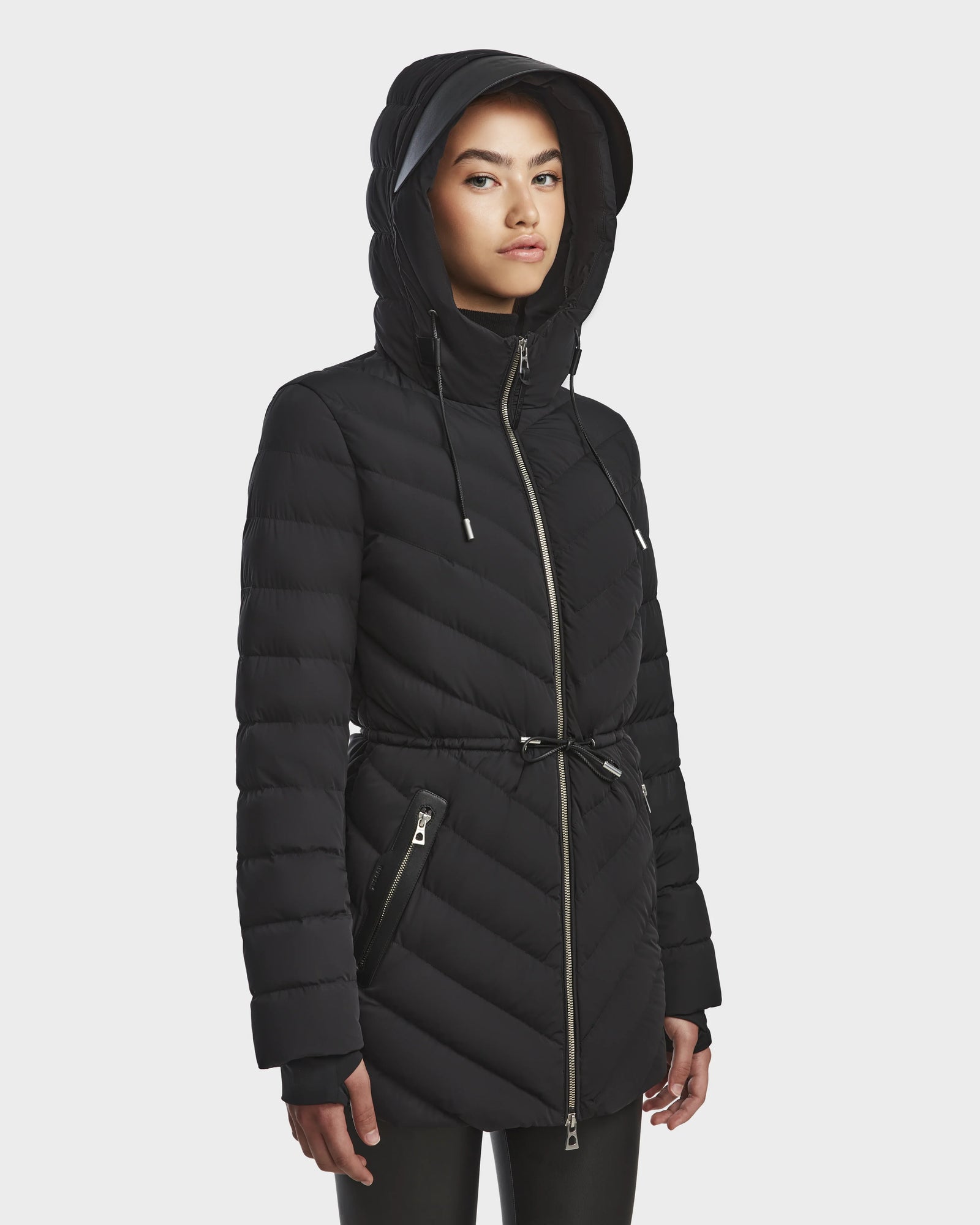 A woman in the Rudsak FRANCINE - 8124722 Black quilted puffer coat.