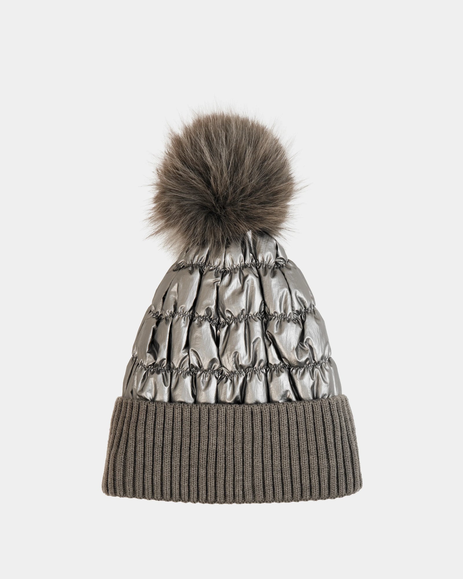 The LANYA - L423514 Pewter by Rudsak is a silver-toned winter hat with ruched details, a large brown pom-pom, and a wide ribbed taupe brim, set against a plain white background.
