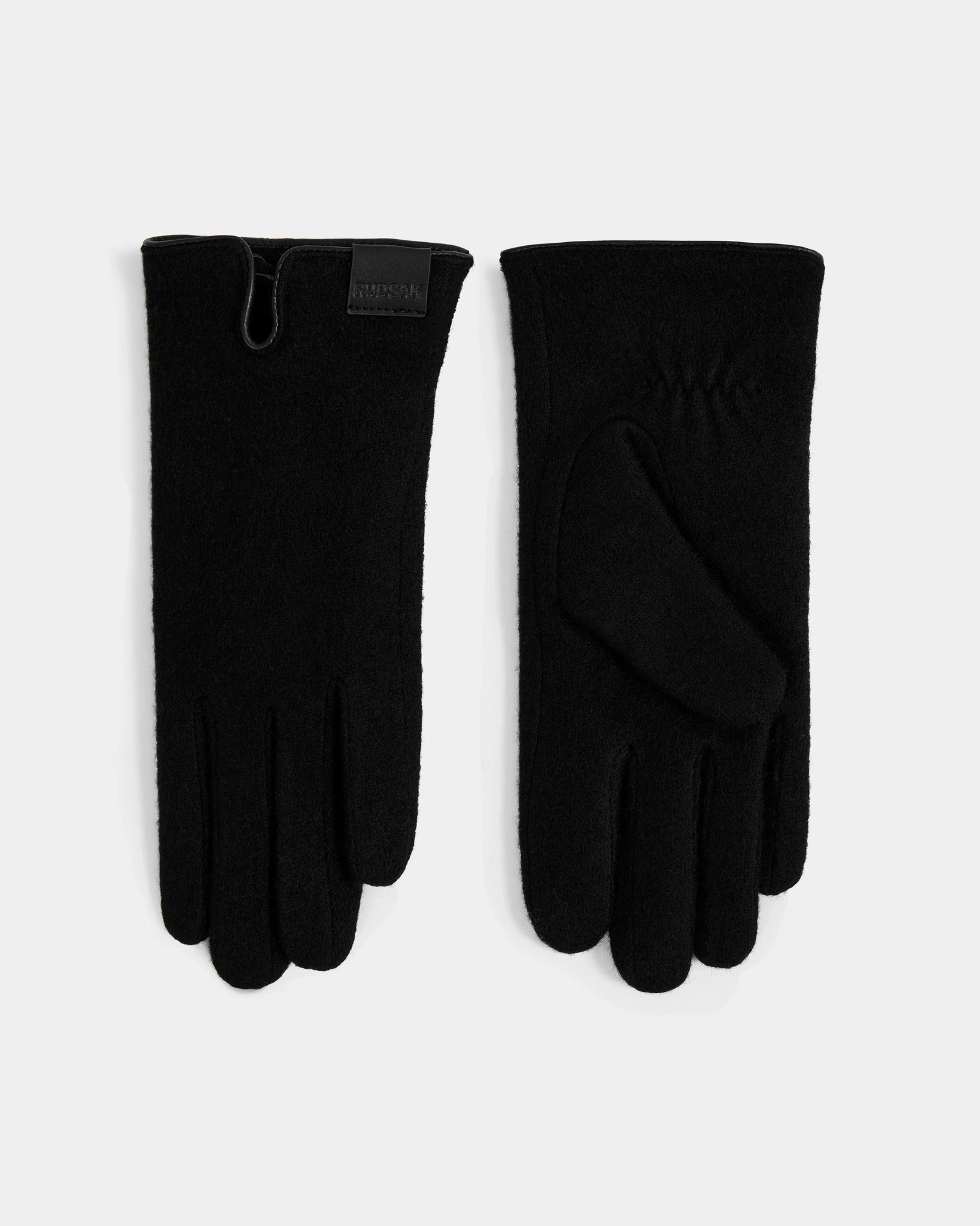 A pair of OLGA - L425541 Black women’s wool gloves by Rudsak is shown on a light surface, one displaying the palm and the other the back with a branded wrist label—an elegant cold-weather accessory.