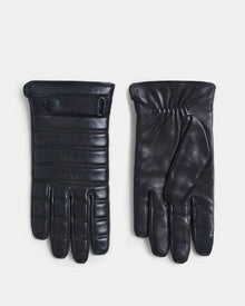 Rudsak CORTES - 6418506 BLACK leather gloves shown with one palm up and one palm down to display quilted stitching on the back and an elasticized wrist—stylish winter accessories.