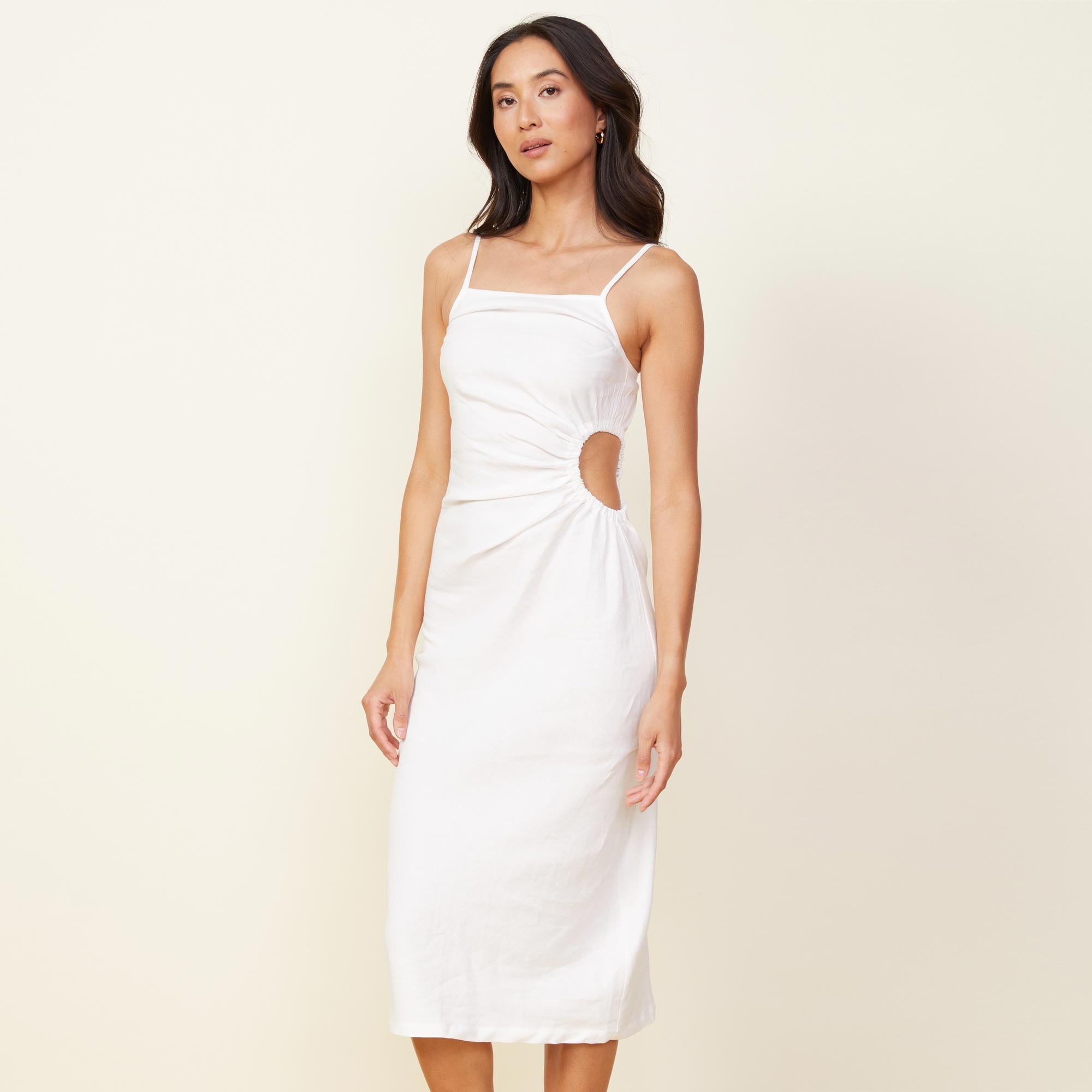 Front view of model wearing the linen slip dress in white.