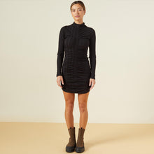 Front view of model wearing the flat rib mock shirred dress in black.