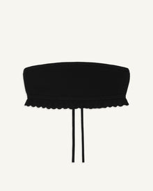 Black bandeau top with scalloped lace trim along the hem