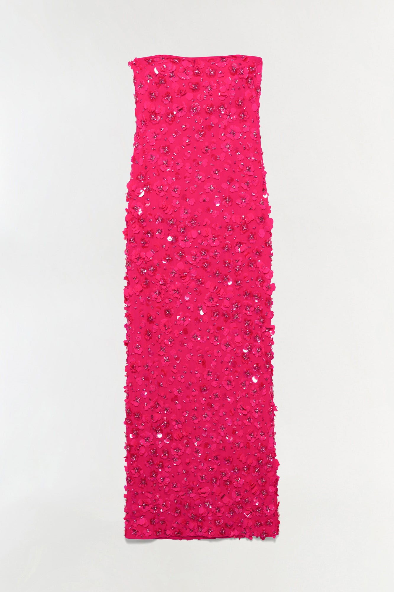 Hot pink strapless gown covered in sequin and beaded embellishments throughout.