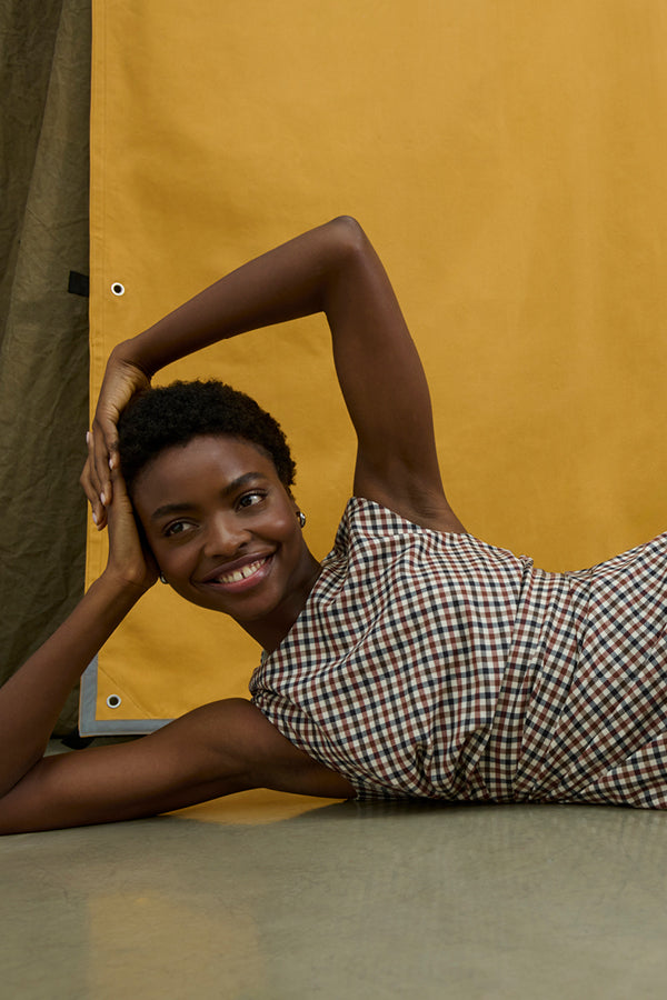 image of a woman wearing the jeannine dress in windowpane sharkskin | Exclude