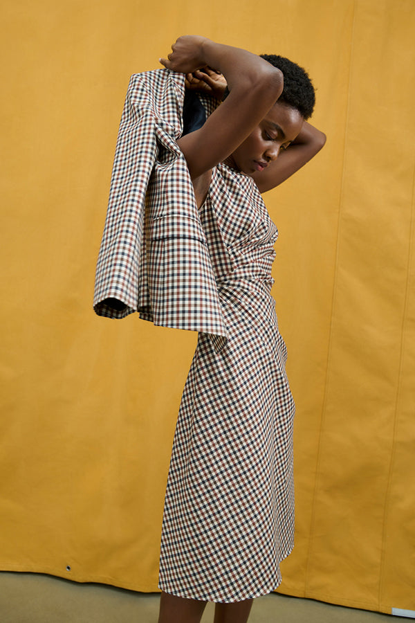 image of a woman wearing the jeannine dress in windowpane sharkskin | Exclude | Still