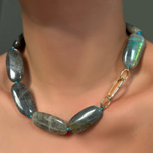 Labradorite Long Oval Necklace with pavé oval charm lock on a model's neck.