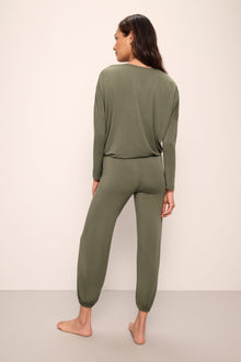 Model wears Gisele TENCELâ„¢ Modal Slouchy PJ Set in moss/ivory.