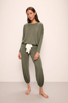 Model wears Gisele TENCELâ„¢ Modal Slouchy PJ Set in moss/ivory.