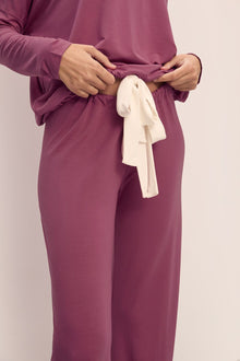 Model wears Gisele TENCELâ„¢ Modal Slouchy PJ Set in Raspberry/Ivory.