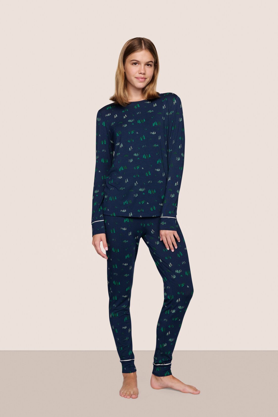 Model is wearing Gisele Printed TENCEL Modal Crewneck PJ Set in Forest Pine Navy/Ivory