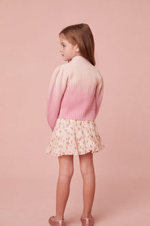 This sweater has a v-neck that descends to four flower buttons at center front. Pleated blouson sleeves extend to ribbed cuffs at opening and a dip-dye technique gives off a stunning gradient effect where itâ€™s darker on the bottom and lighter on the top.