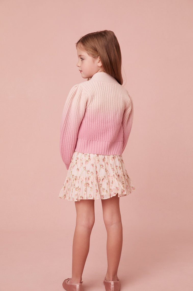 This sweater has a v-neck that descends to four flower buttons at center front. Pleated blouson sleeves extend to ribbed cuffs at opening and a dip-dye technique gives off a stunning gradient effect where itâ€™s darker on the bottom and lighter on the top.