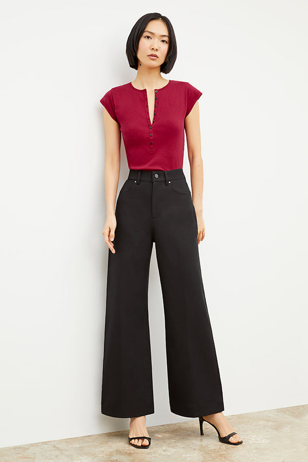 Front image of a woman standing wearing the Milo Jean in ink | Exclude