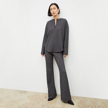Front image of a woman wearing the tully top in black and white