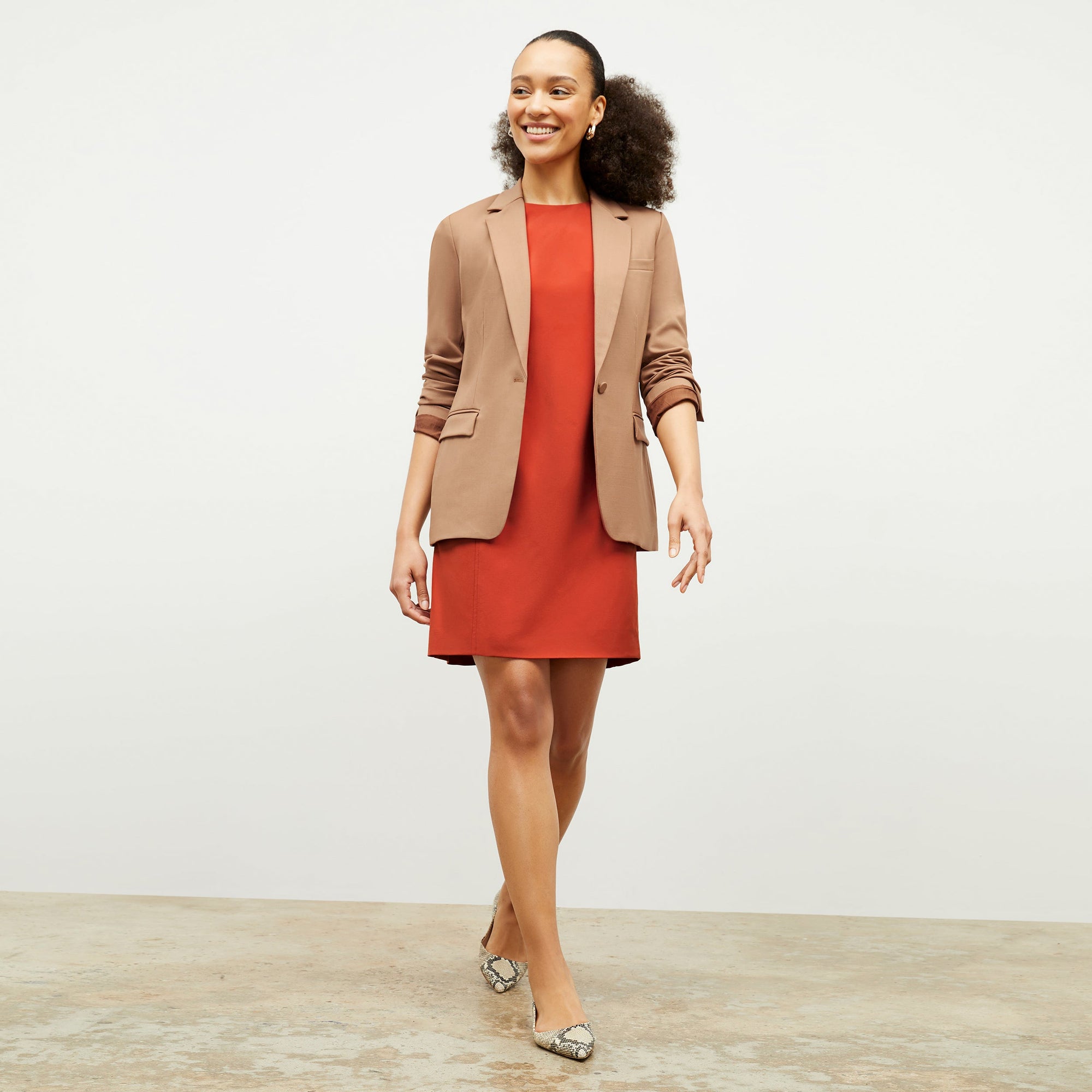 Front image of a woman standing wearing the Yiyan Blazer in Camel | Exclude