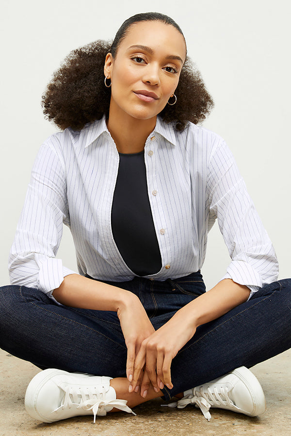 Front image of a woman wearing the Mila Button Down - Poplin Stripe in Blue / Ivory | Exclude