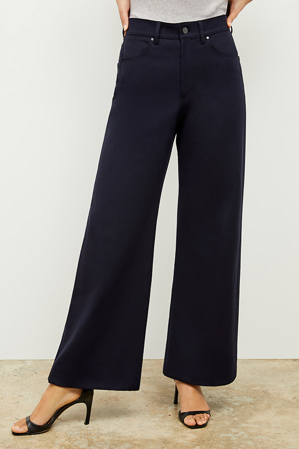 Front image of a woman standing wearing the Milo Jean in ink | Exclude