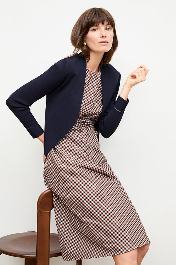 front image of a woman wearing the jeannine dress in windowpane sharkskin | Exclude