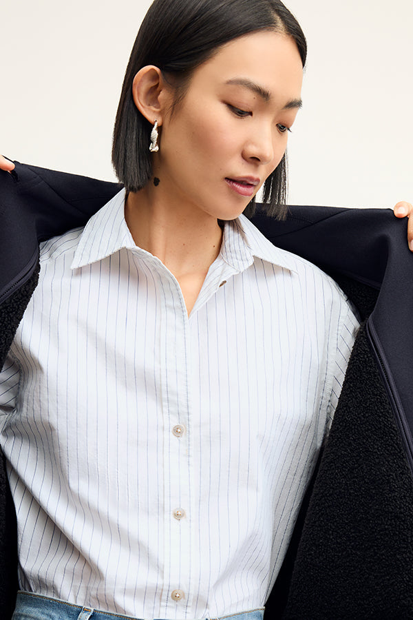 Front image of a woman wearing the Mila Button Down - Poplin Stripe in Blue / Ivory | Exclude